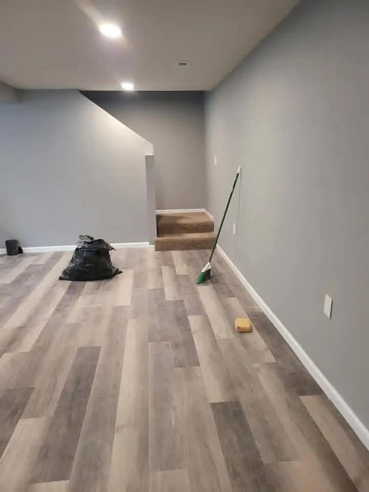 Finished basement family room with vinyl plank flooring in a Sioux Falls home